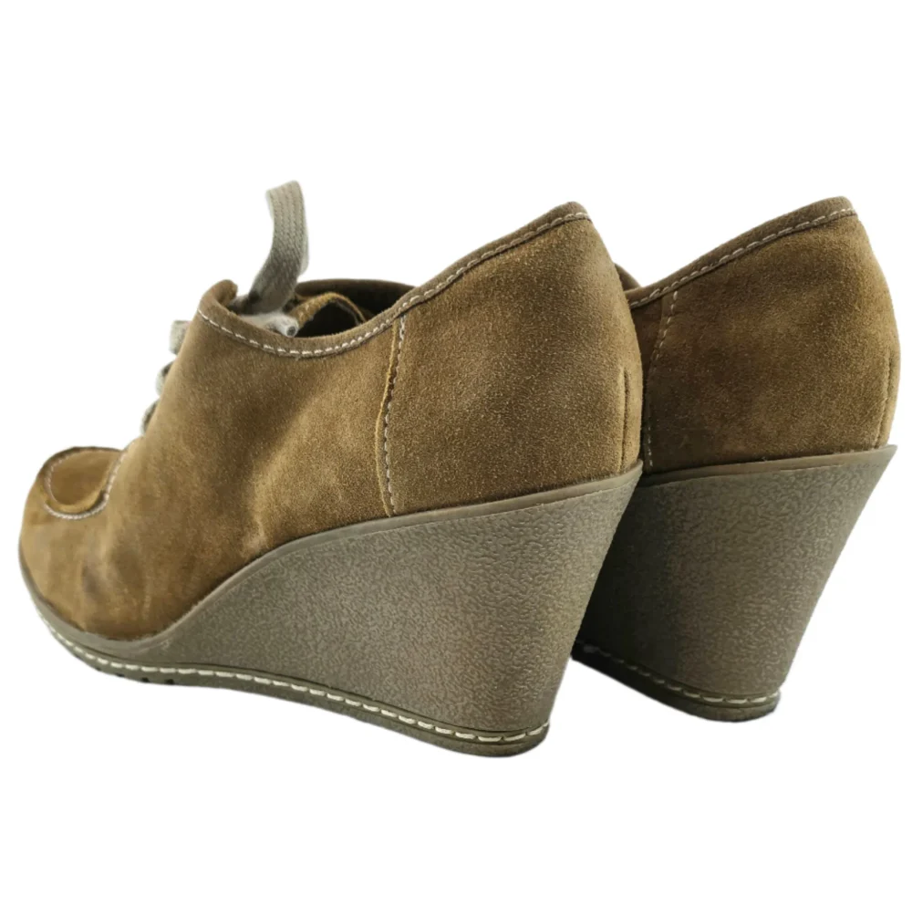 Back view of vintage suede wedge shoes showcasing their retro silhouette and craftsmanship