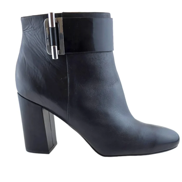Side view of a black leather Michael Kors vintage ankle boot with a block heel.