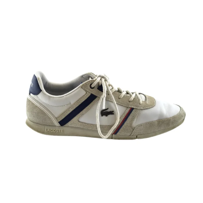 Side view of Vintage Shoes Lacoste in white suede and leather with blue and red stripes Side view of Vintage Shoes Lacoste in white suede and leather with blue and red stripes