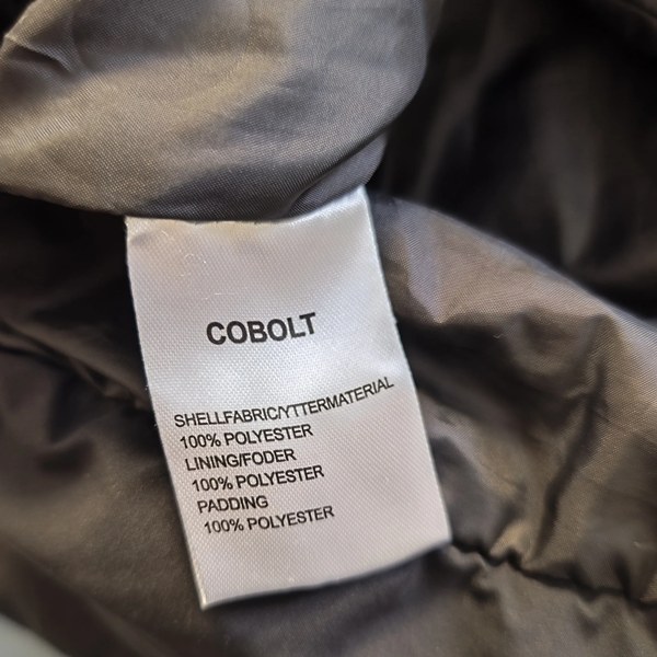 Vintage COBOLT Steppmantel Schwarz Retro-90er-Stil Materialetikett